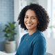 A diverse woman with a friendly, trustworthy expression for a customer testimonial badge.